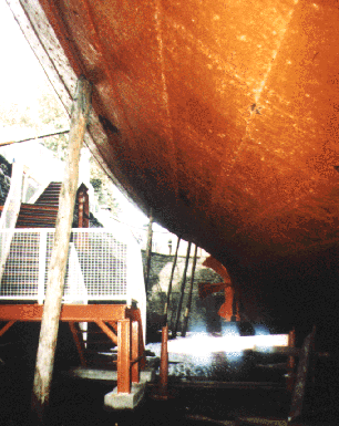 wooden shores against the hull.
