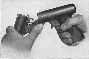 Figure 17.-Opening Breech of Signal Pistol Mk 5 Mod 0