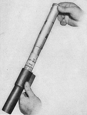 Figure 39.-Loading Submarine Rocket Signal Mk 1 (Comet)