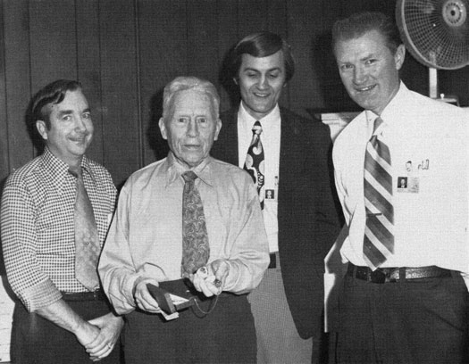 Bryn Boerse with 3 other men while receiving his award.