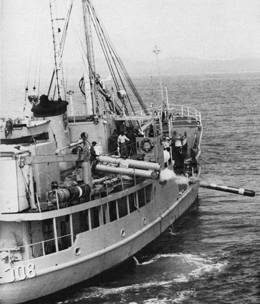 Photo of torpedo being fired from deck.