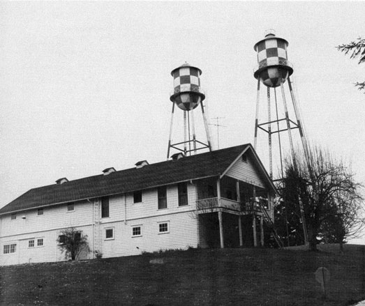 Photo of the water towers with building #17 in the foreground.