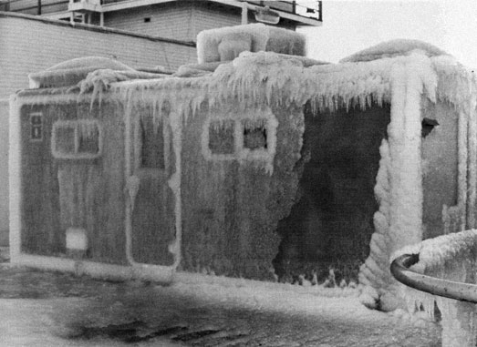 Small building covered with ice.