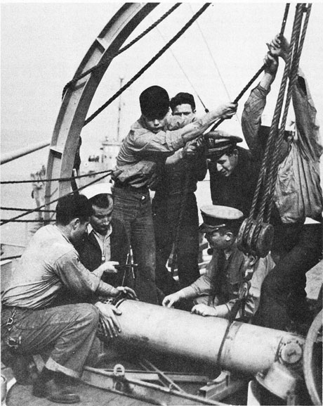 Crew rigging on deck.