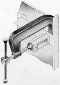 Fig. 28-Dog bracket clamped in placeready for installation.