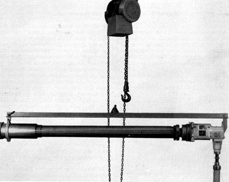 Figure 4-11. Adjustable roller stand placed under eyepiece box.