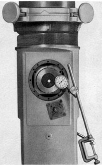 Figure 4-59. Dial indicator determination of true
vertical position on the right side face of the eyepiece alignment jig.