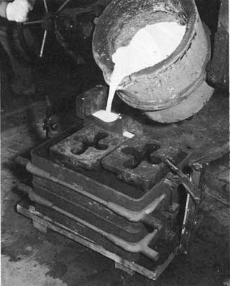 Figure 91. Pouring the mold.