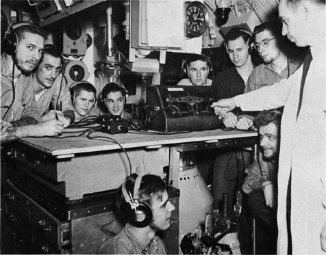 Nine sailors and one doctor gathered in the control room for testing.