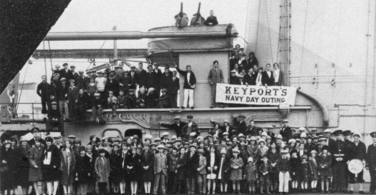 Photo of teachers and children posed aboard ship.
