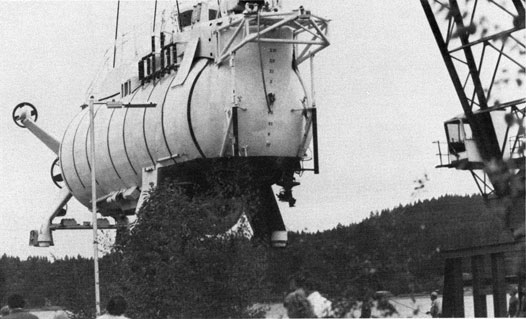 Trieste II being lifted off a barge.