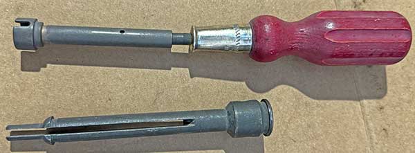 firing pin tool above broken cartridge extractor.