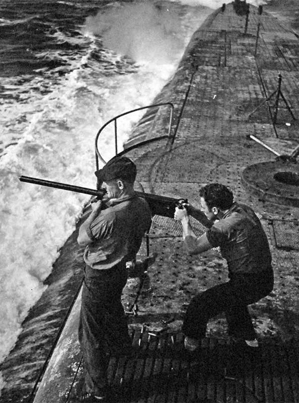 one crew feeding belt, one firing on main deck