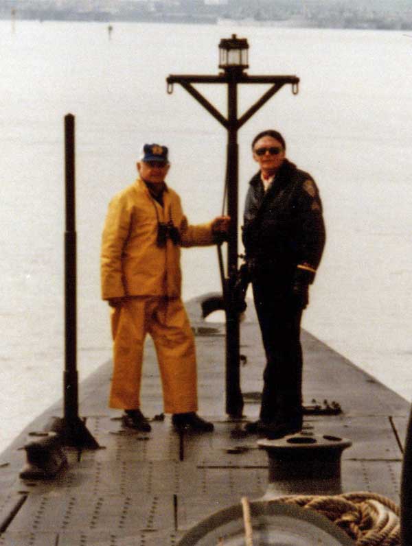 two guys next to bow light, mast