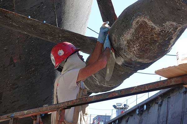 shipyard worker wrapping fiberglass