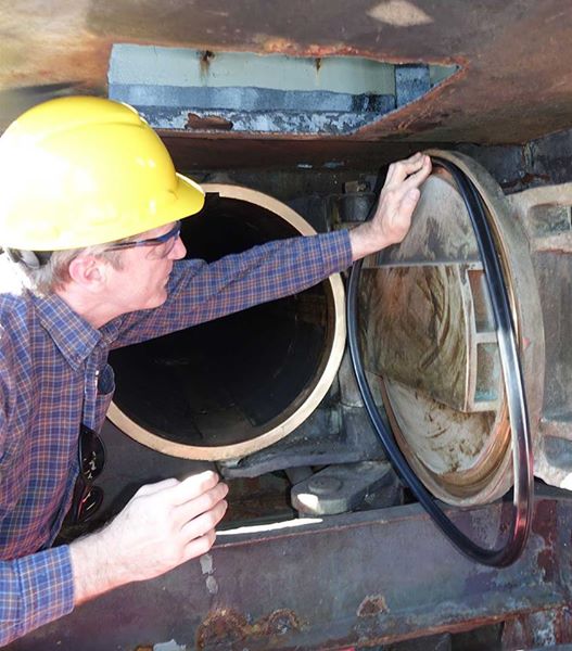 Paul Flowers inspecting the gasket fit before modification