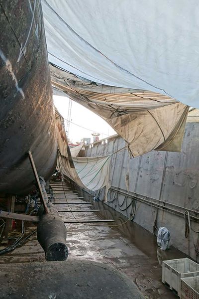 torn up tarps over wet drydock