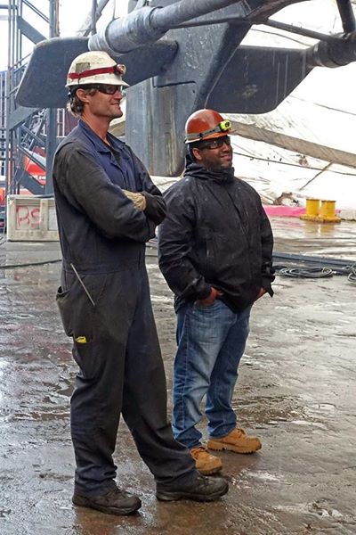 photo of Aaron standing in the rain with the marine chemist