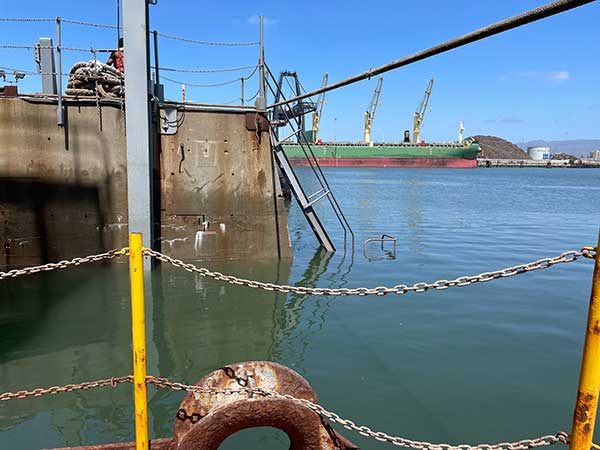 side of drydock partially lifted