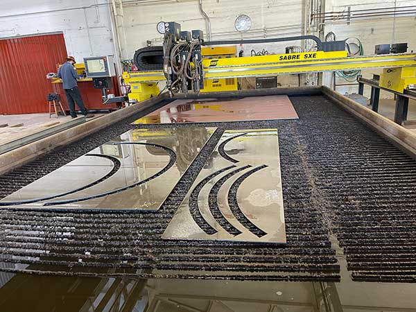 waterjet with steel remaining from cuts