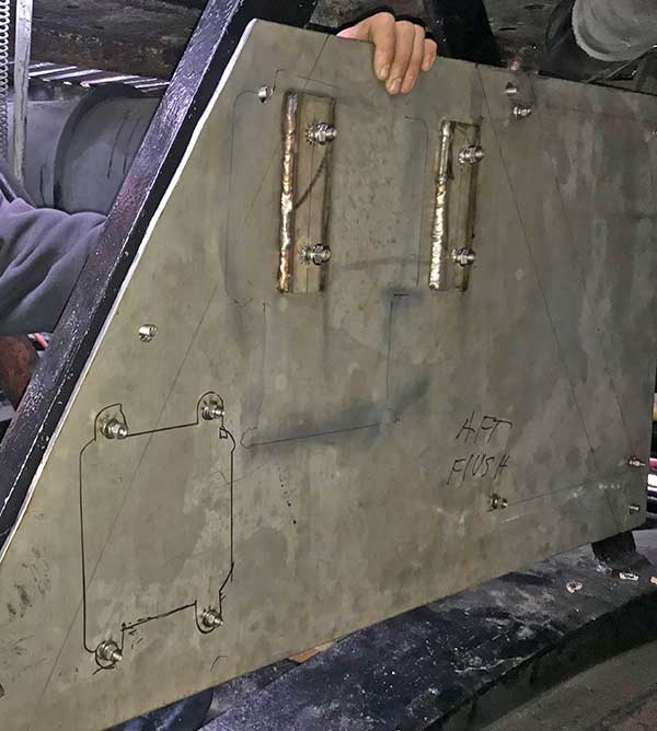 panel held in place by hand