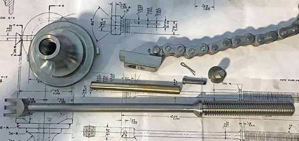 Breech operating spring nut, shaft, clevis, keeper, chain.