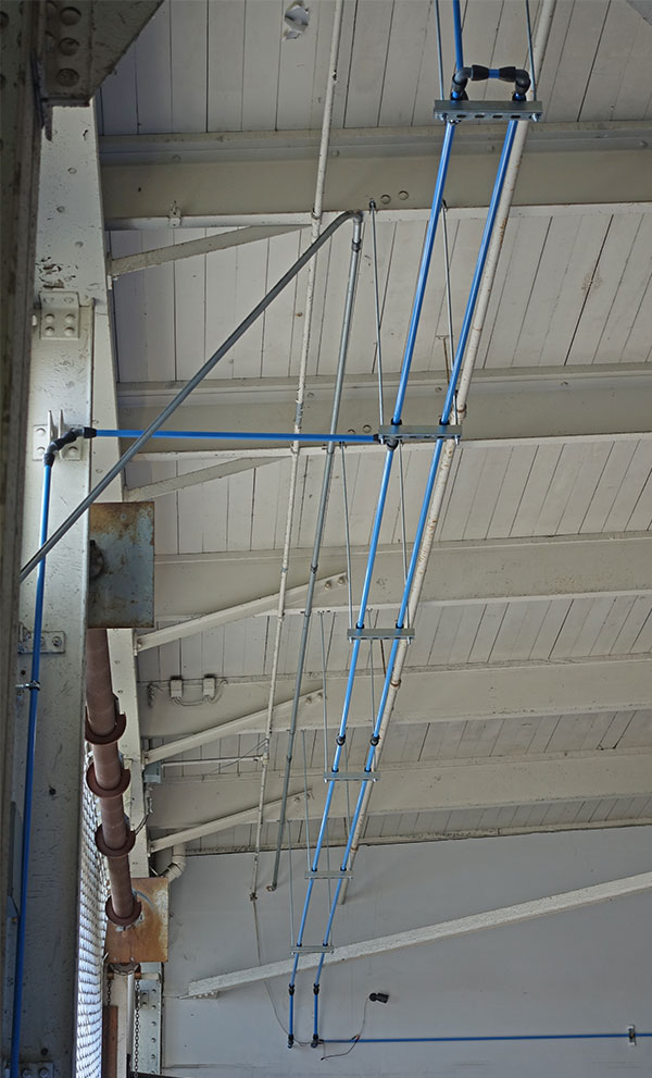 photo of air piping loop hung from the ceiling
