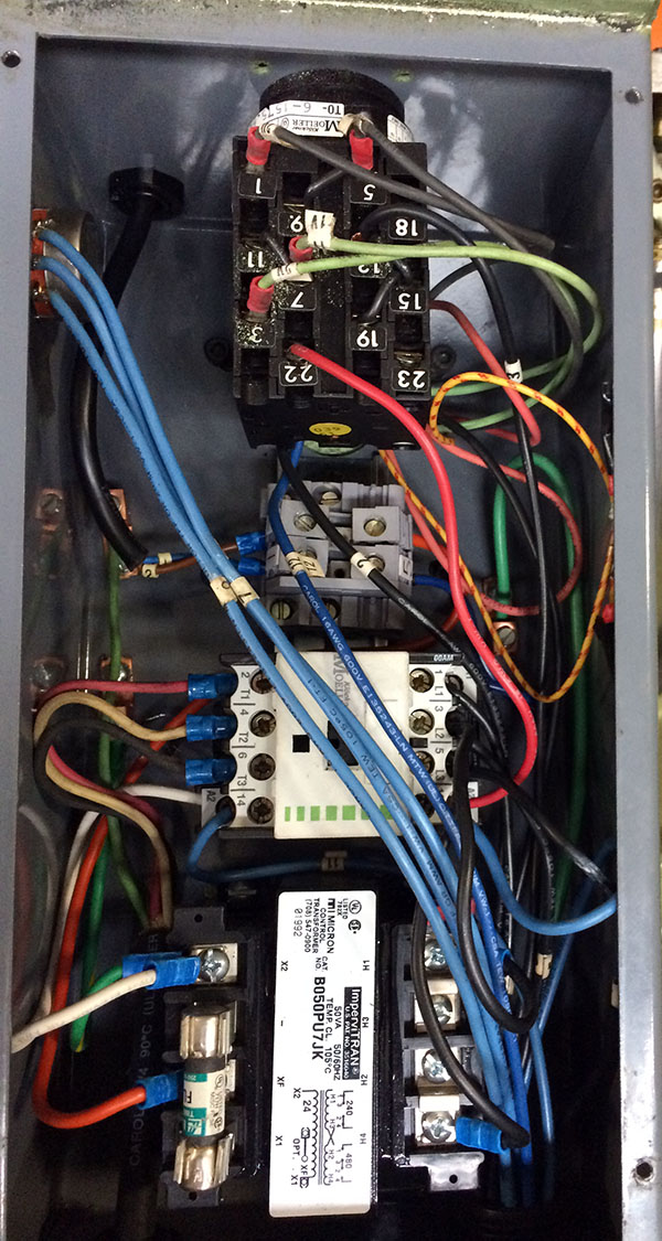 Photo of the inside of the cold saw electrical box.
