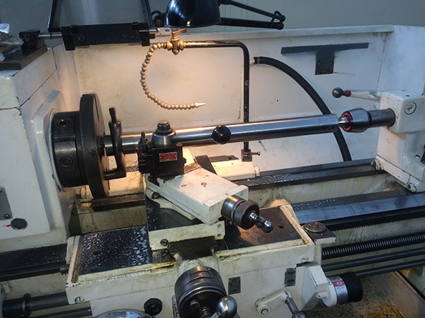 lathe with test bar mounted on centers